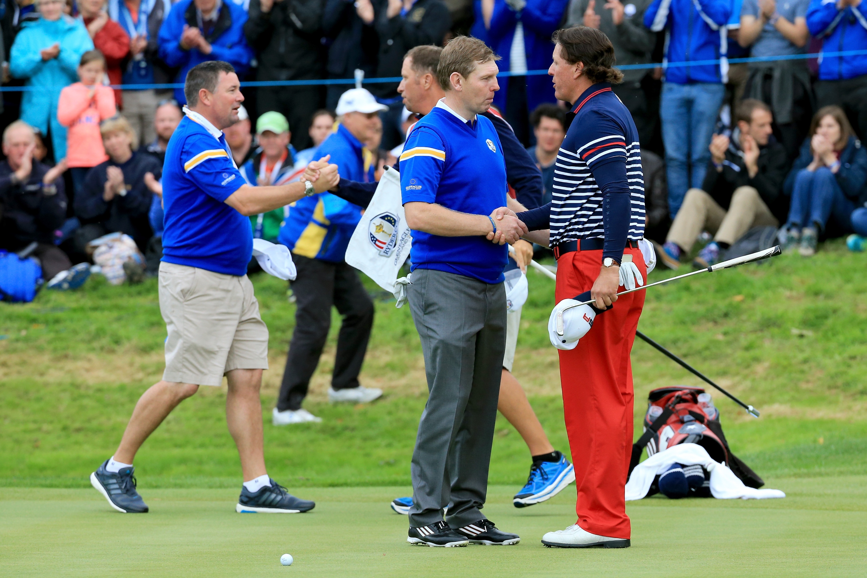 AUCHTERARDER, SCOTLAND - SEPTEMBER 28: Stephen Gallacher of Europe shakes hands with Phil Mickelson of the United States after his defeat on the 17th hole during the Singles Matches of the 2014 Ryder Cup on the PGA Centenary course at the Gleneagles Hotel on September 28, 2014 in Auchterarder, Scotland. (Photo by David Cannon/Getty Images)