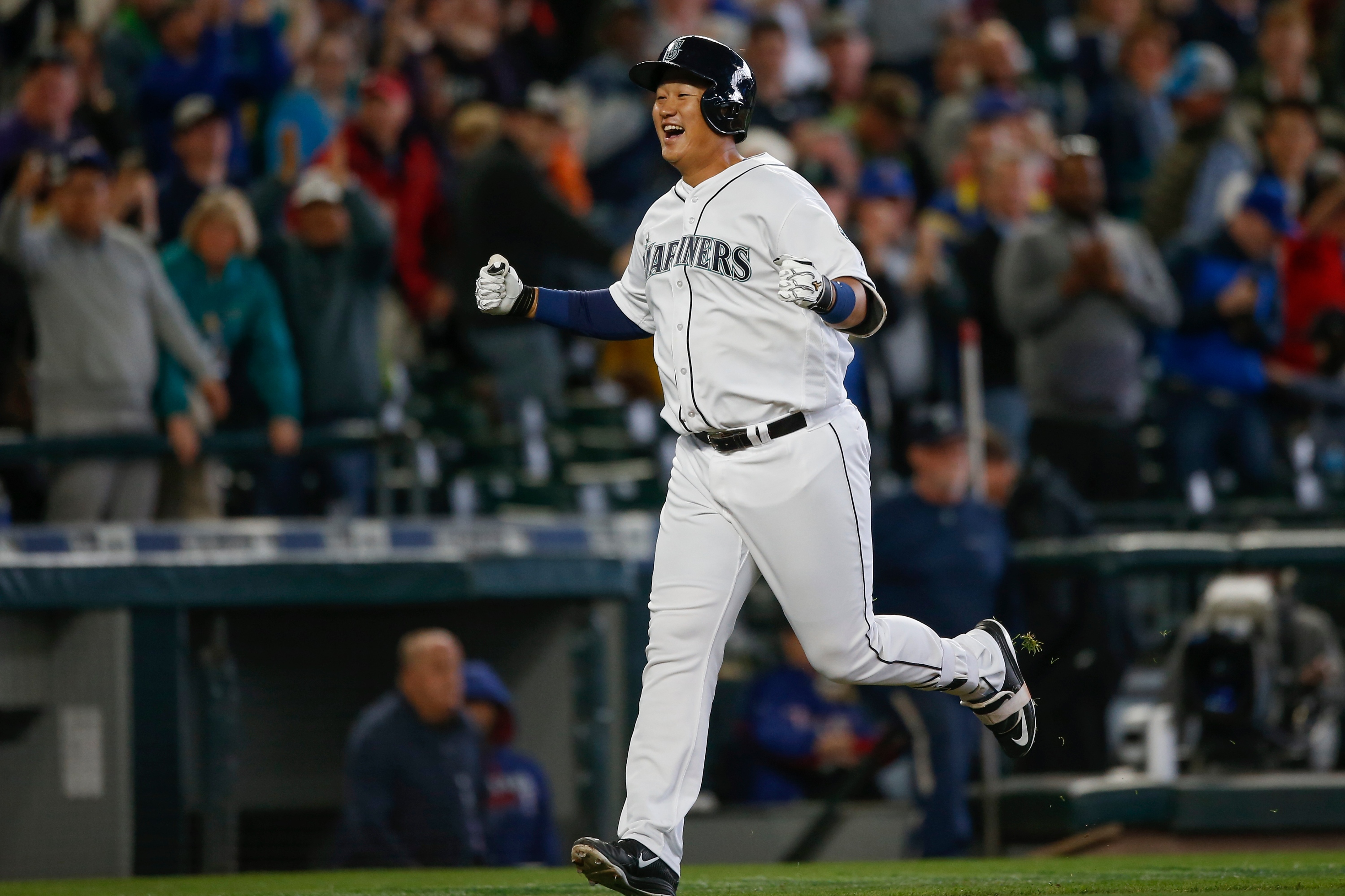 Dae-ho Lee of the Seattle Mariners celebrates as he rounds third a on a game-winning two-run homer in the tenth inning. (Photo by Otto Greule Jr/Getty Images)