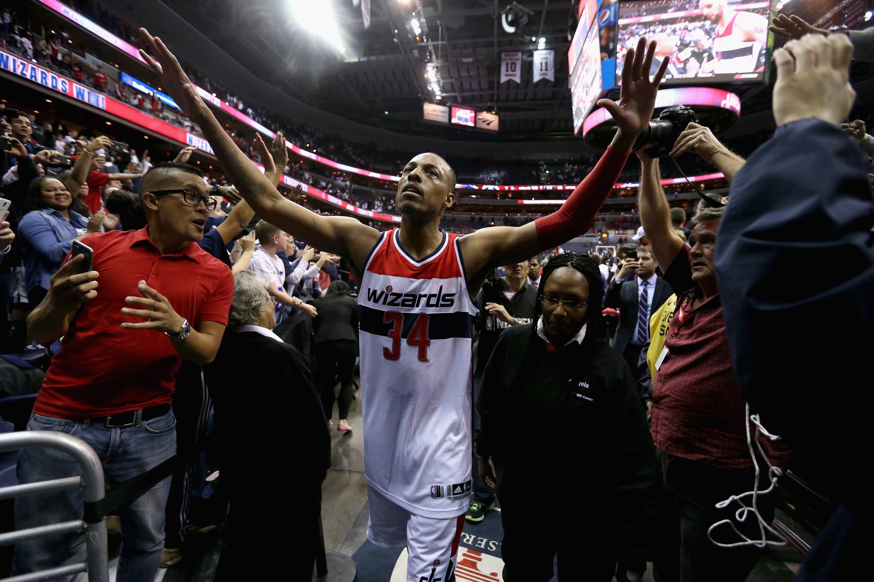 Paul Pierce high-fives fans while thinking of killer new Photoshops. (Rob Carr/Getty Images)
