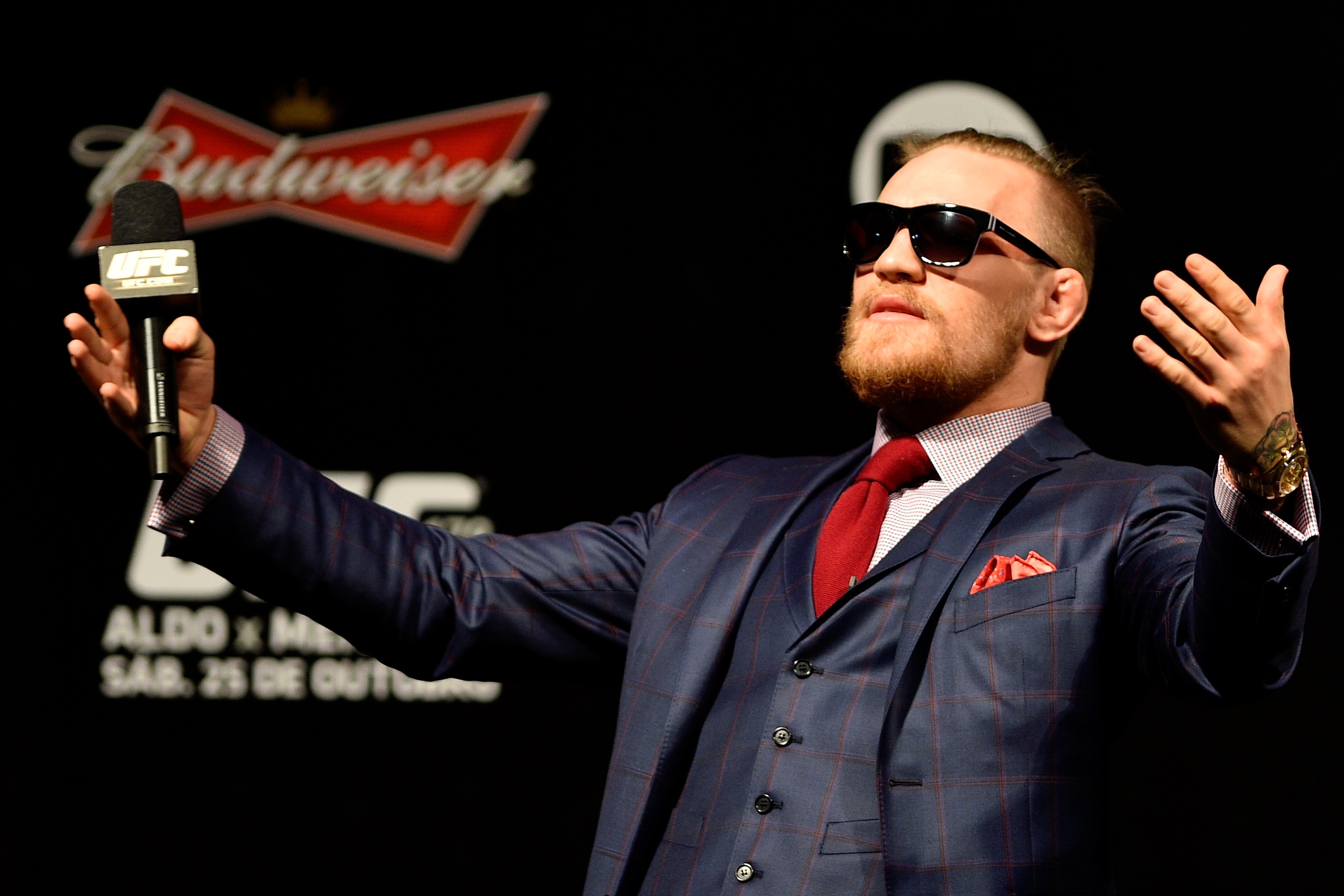 Conor McGregor plays to the crowd during a UFC press event. (Getty)