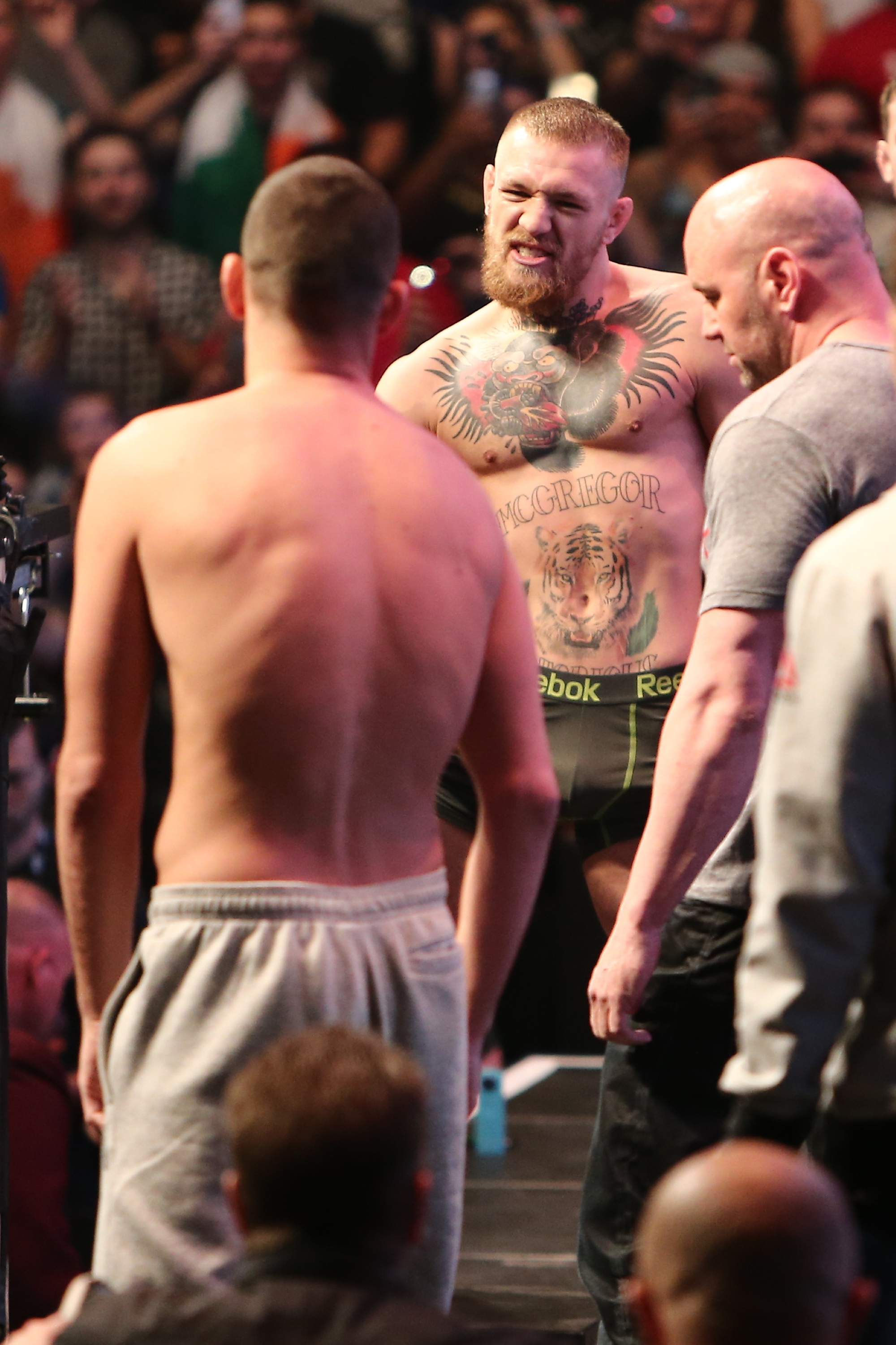 Conor McGregor yells at Nate Diaz during their weigh-in face-off for their UFC 196 fight. (Getty)