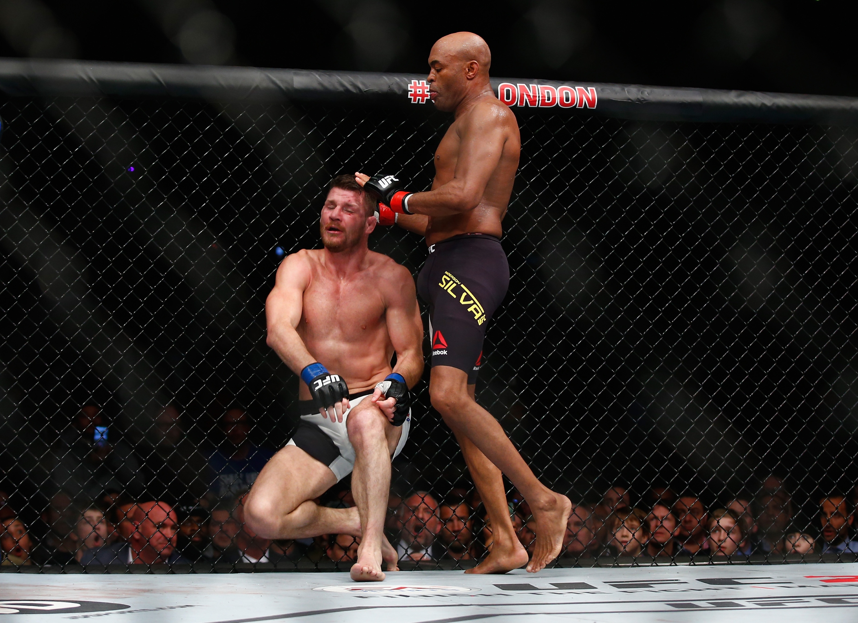 Anderson Silva lands a knee on Michael Bisping at the end of the third round on Saturday. (Getty)