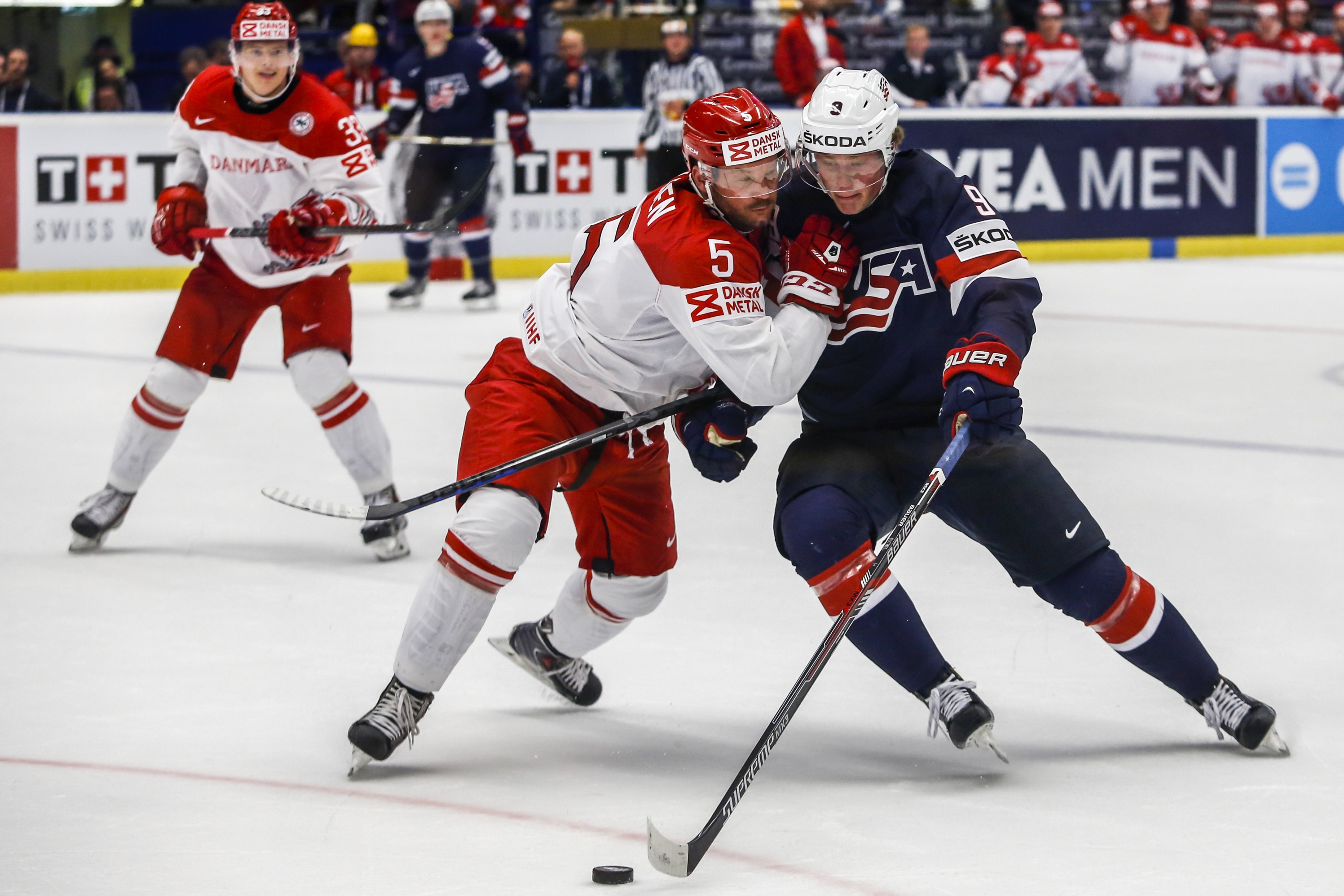 OSTRAVA, CZECH REPUBLIC - MAY 08: Jack Eichel (R) of the United States and Daniel Nielsen (L) of Denmark battle for the puck during the IIHF World Championship group B match between USA and Denmark at CEZ Arena on May 8, 2015 in Ostrava, Czech Republic. (Photo by Matej Divizna/Getty Images)