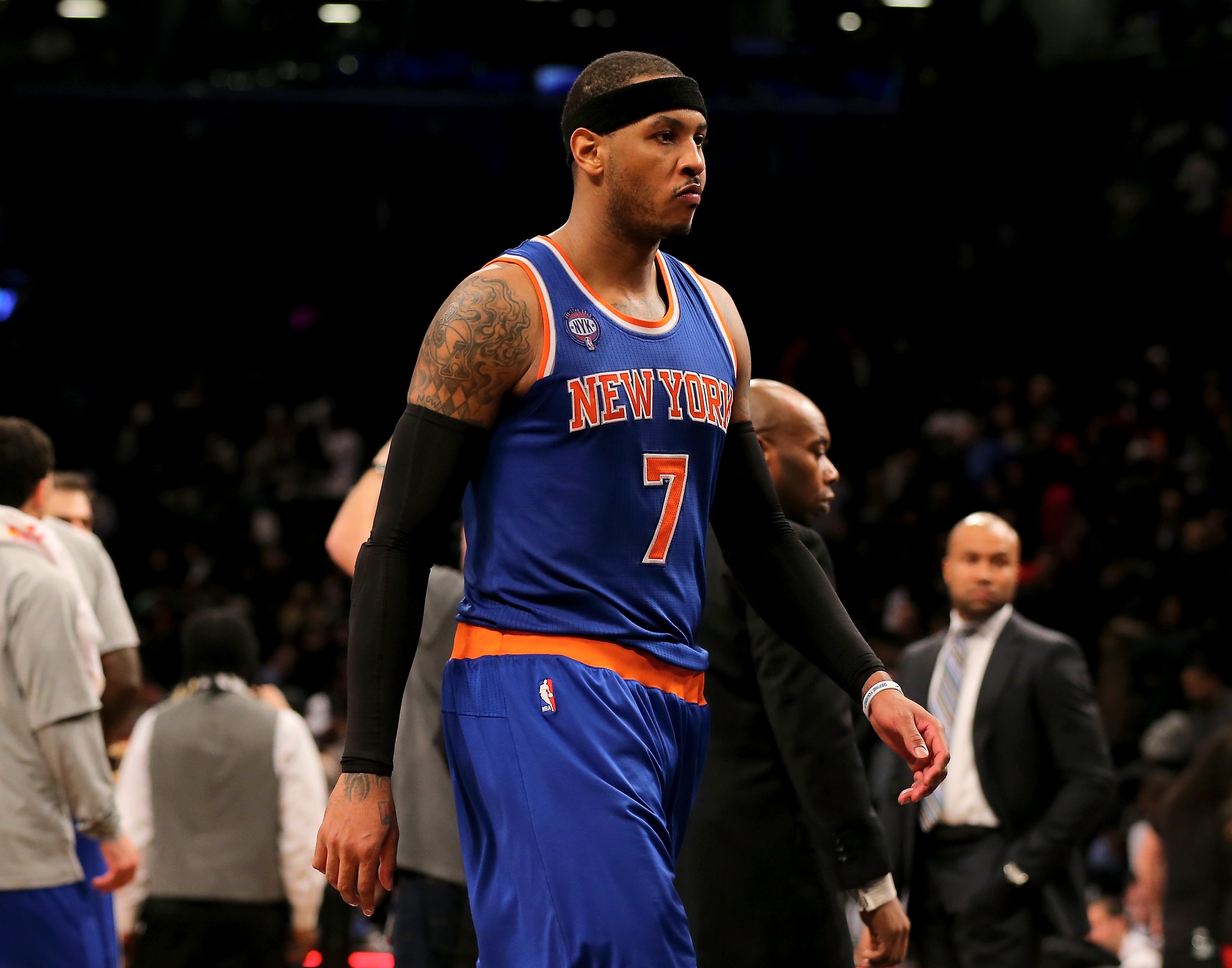 NEW YORK, NY - FEBRUARY 06:  Carmelo Anthony #7 of the New York Knicks walks off the court after the game against the Brooklyn Nets at the Barclays Center on February 6, 2015 in the Brooklyn borough of New York City.The Brooklyn Nets defeated the New York Knicks 92-88. NOTE TO USER: User expressly acknowledges and agrees that, by downloading and/or using this photograph, user is consenting to the terms and conditions of the Getty Images License Agreement.  (Photo by Elsa/Getty Images)