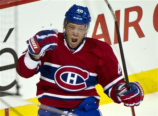 Montreal Canadiens' Andrei Kostitsyn celebrates a goal against the New York Islanders during the first period of an NHL hockey game, Tuesday, Dec. 13, 2011, in Montreal. (AP Photo/The Canadian Press, Paul Chiasson)