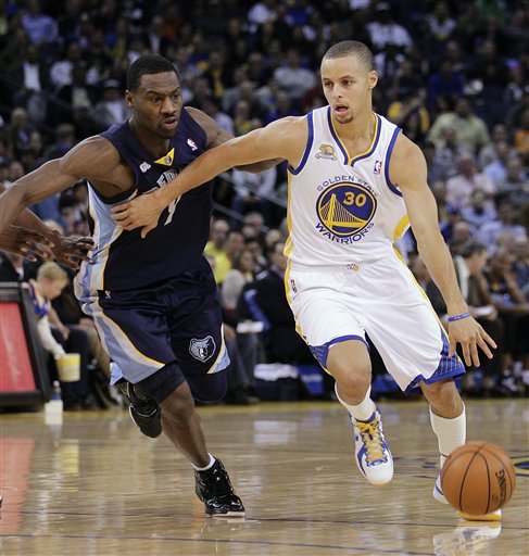 Golden State Warriors' Stephen Curry, right, drives the ball past Memphis Grizzlies' Tony Allen during the first half of an NBA basketball game Wednesday, March 7, 2012, in Oakland, Calif. (AP Photo/Ben Margot)