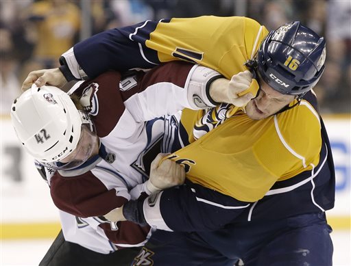 Colorado Avalanche center Brad Malone (42) fights with Nashville Predators left wing Rich Clune (16) in the first period of an NHL hockey game Tuesday, April 2, 2013, in Nashville, Tenn. (AP Photo/Mark Humphrey)