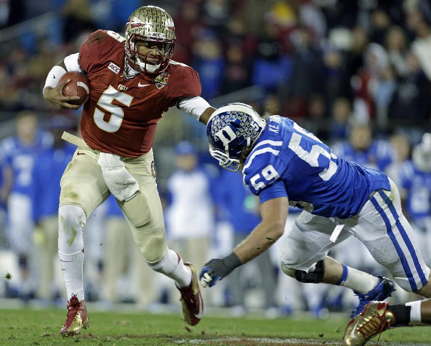 FILE - In this file photo from Dec. 7, 2013, Florida State's Jameis Winston (5) scrambles as Duke's Kelby Brown (59) defends in the first half of the Atlantic Coast Conference Championship NCAA football game in Charlotte, N.C. The No. 1-ranked Florida State held their final workout on campus Monday, Dec. 30 2013, before flying to California to face No. 2 Auburn in the BCS NCAA college football championship game. (AP Photo/Bob Leverone, file)