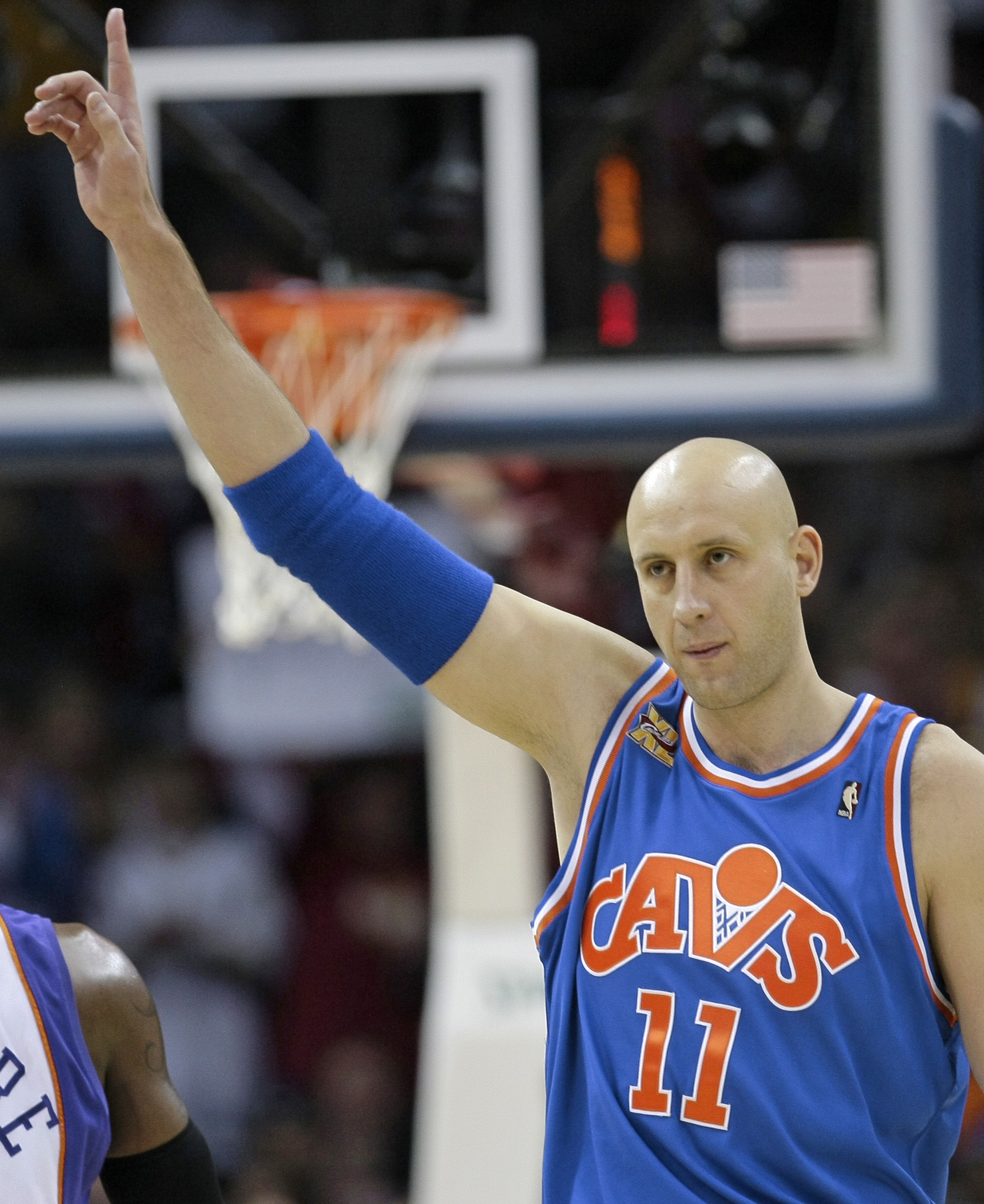 FILE - In this Dec. 2, 2009, file photo, Cleveland Cavaliers' Zydrunas Ilgauskas, of Lithuania, acknowledges the crowd while entering an NBA basketball game against the Phoenix Suns in Cleveland. Ilgauskas, a gentle giant who connected with Cleveland fans and became one of the city's most beloved athletes, will have his No. 11 jersey retired during halftime ceremonies Saturday, March 8, 2014, by the Cavaliers. (AP Photo/Tony Dejak, File)