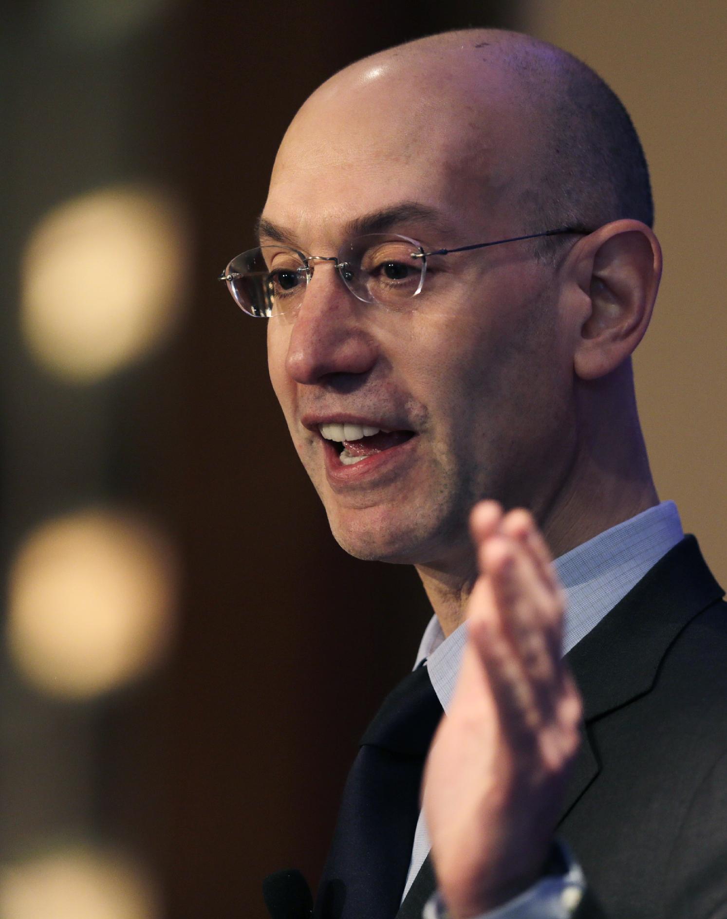 NBA commissioner Adam Silver gestures during an address, Wednesday, March 12, 2014, in Boston. Silver commented on some teams with losing records 