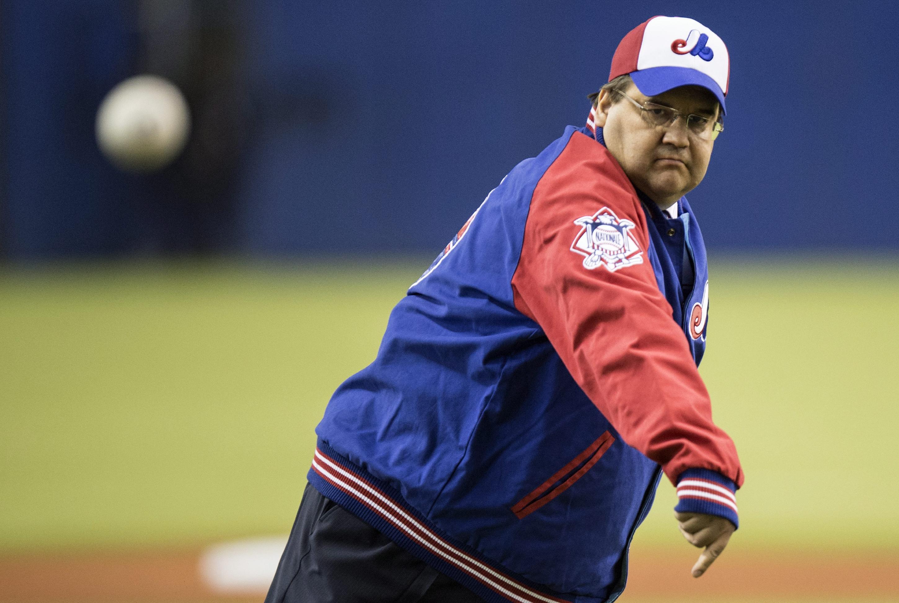 Montreal Mayor Denis Coderre fires the opening pitch prior to a pre-season exhibition baseball game game between the Toronto Blue Jays and the New York Mets. (AP Photo)