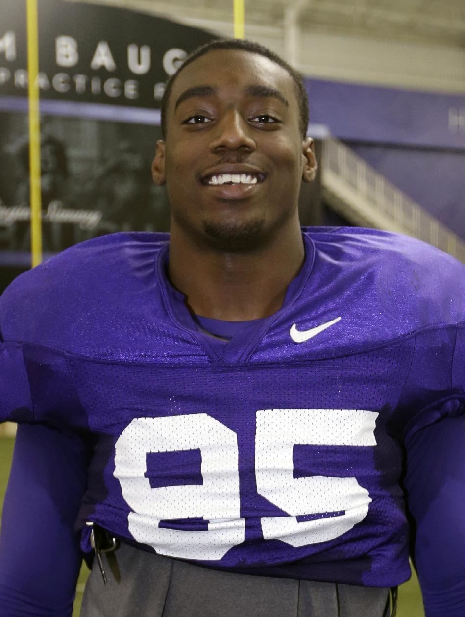 File - In this Dec. 13, 2012 file photo, TCU defensive end Devonte Fields poses for a photo at the team's training facility following a practice for the Buffalo Wild Wings Bowl in Fort Worth, Texas. Fort Worth police are investigating whether Fields pointed a gun at his former girlfriend and punched her in the head. Police said Tuesday, July 22, 2014, that no charges have been filed and Fields, the Big 12's preseason defensive player of the year, has not been arrested. (AP Photo/Tony Gutierrez, File)