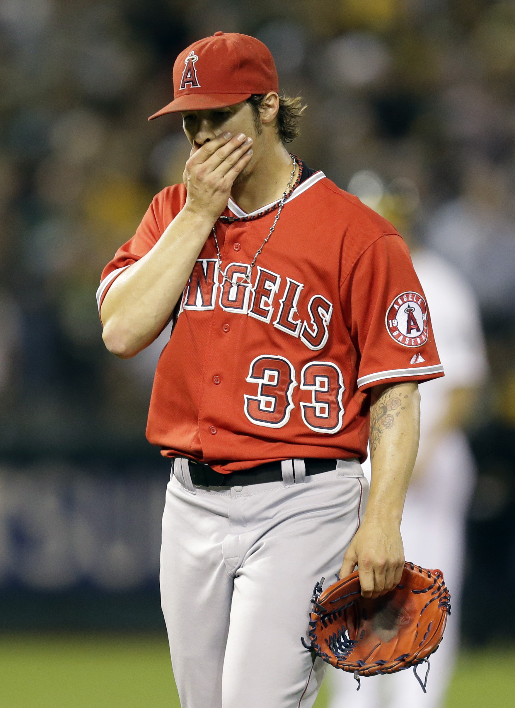 Angels pitcher C.J. Wilson reacts after giving up six runs in the first inning Monday. (AP)