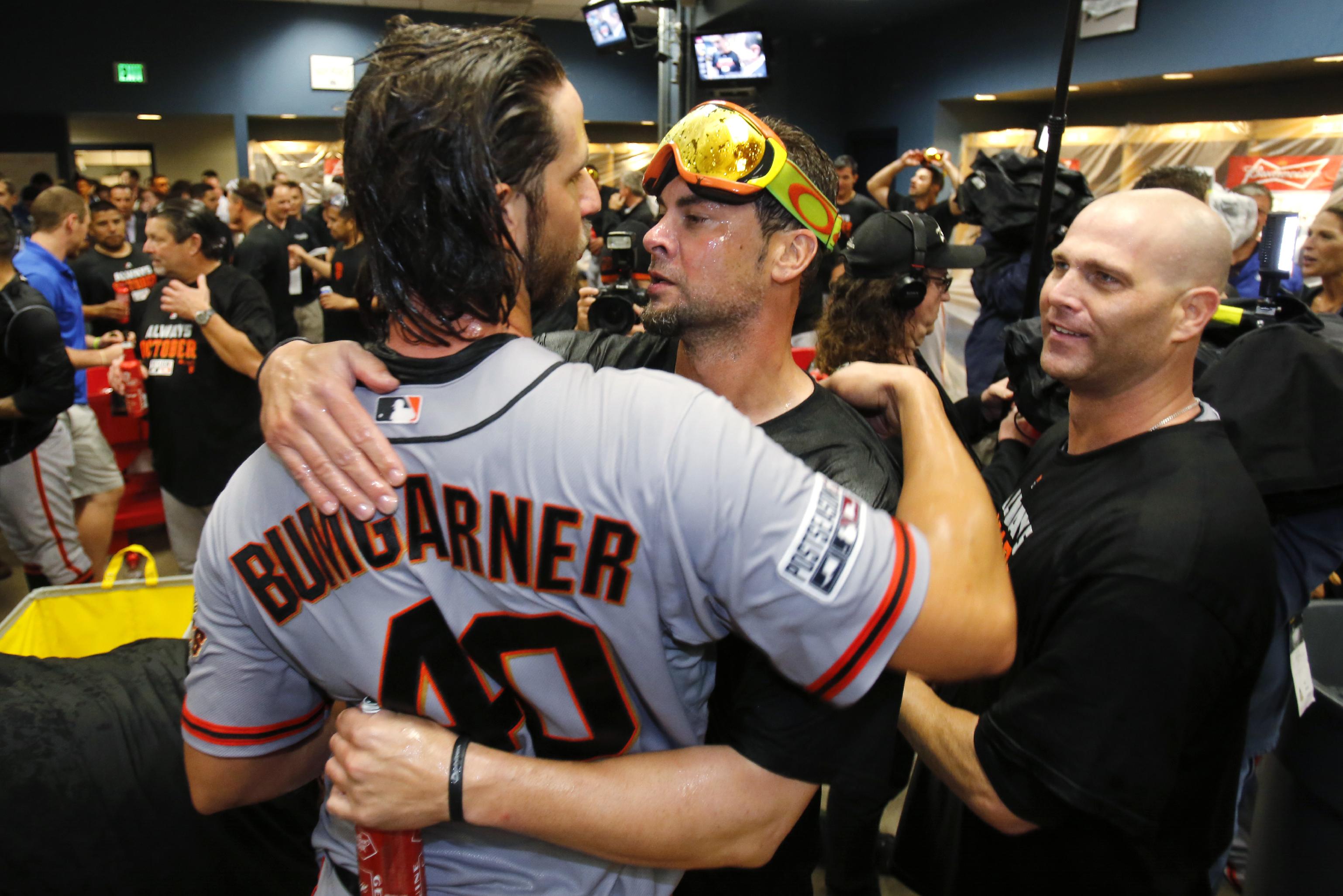 From left: Bumgarner, Ryan Vogelsong and Hudson celebrate the Giants winning the NLDS. (AP)