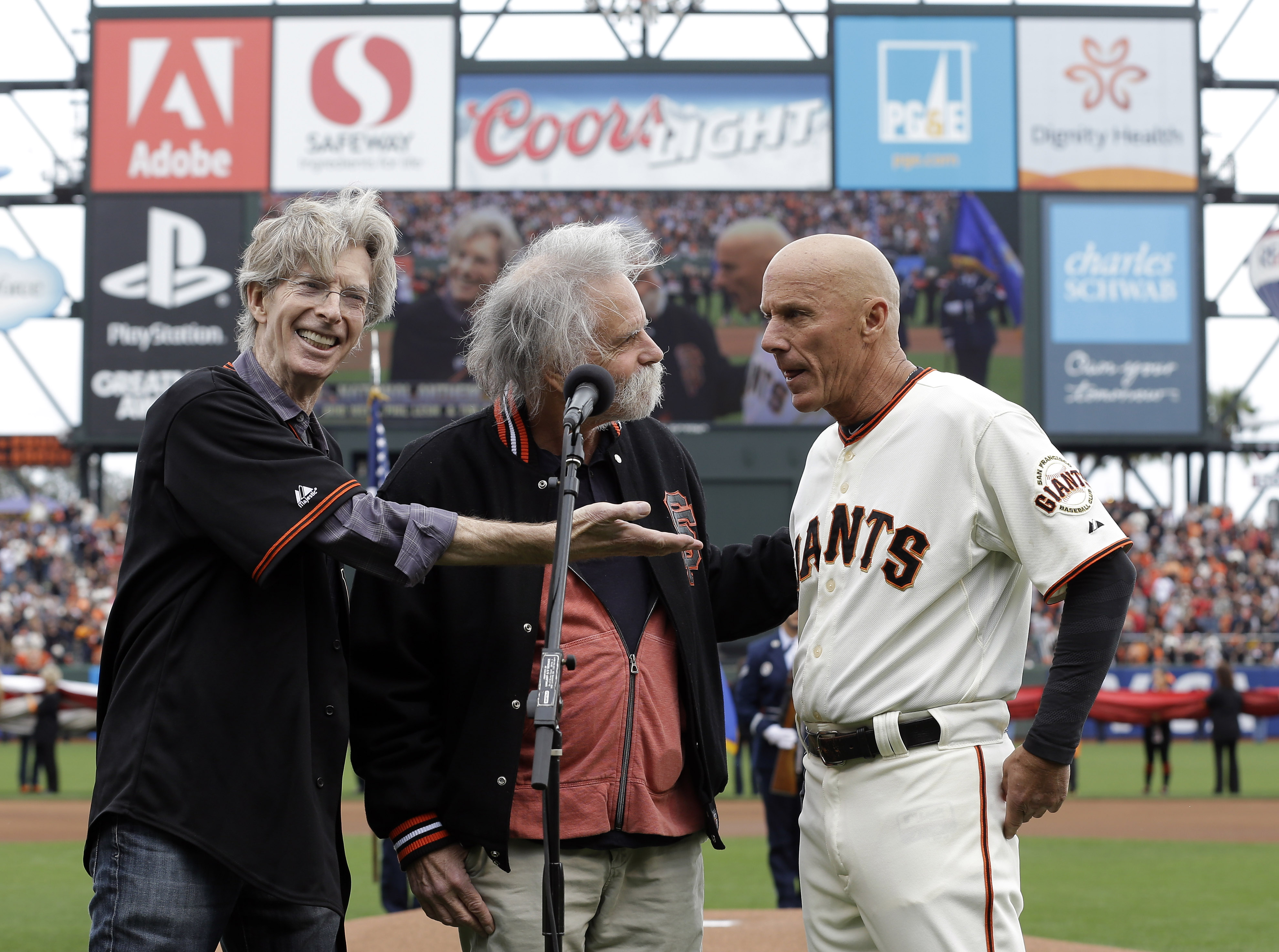 Tim Flannery (far right) joins the Grateful Dead's Phil Lesh, and Bob Weir for the national anthem. (AP)