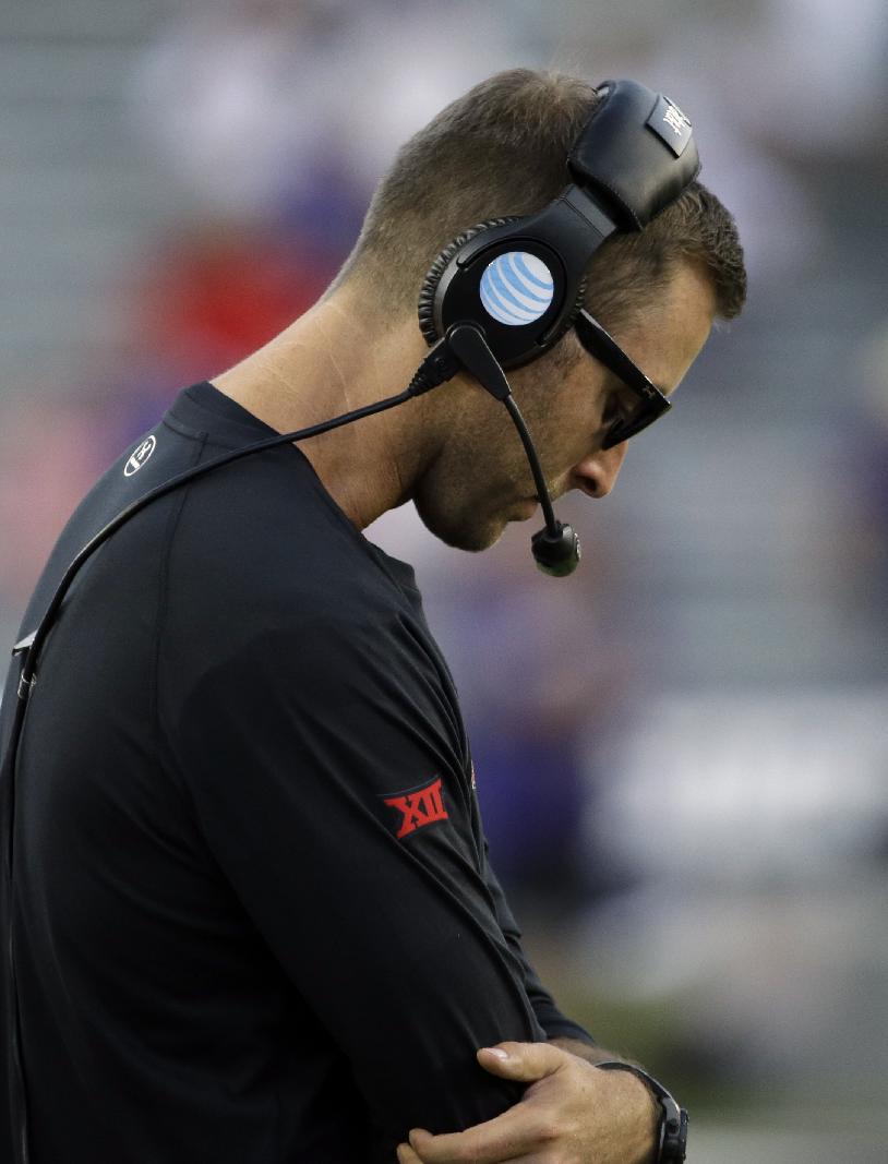 Texas Tech head coach Kliff Kingsbury stands on the sideline late in the second half of an NCAA college football game against TCU, Saturday, Oct. 25, 2014, in Fort Worth, Texas. TCU won 82-27. (AP Photo/Tony Gutierrez)
