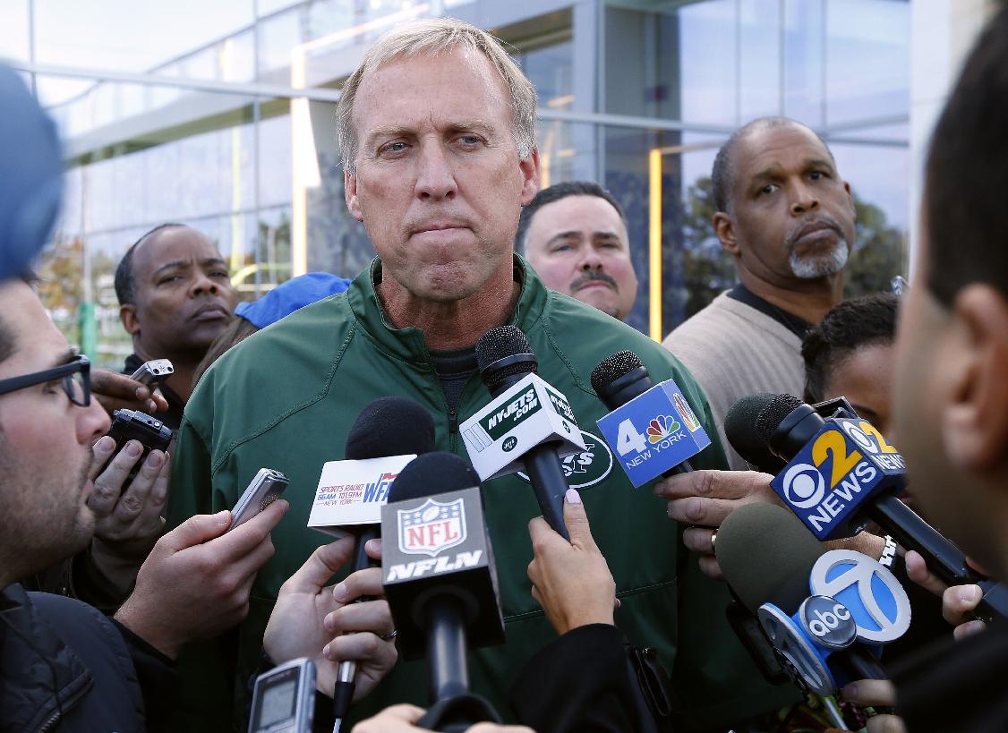 FILE - In this Monday, Oct. 20, 2014 file photo, New York Jets General Manager John Idzik talks about the trade for wide receiver Percy Harvin from Seattle during NFL football practice in Florham Park, N.J. Frustrated Jets fans have taken to the air to vent. Literally. A plane with a banner urging the team to fire John Idzik circled several times above the practice field for about 20 minutes Wednesday, Nov. 5, 2014 as the players went through drills while New York's embattled general manager watched. (AP Photo/Rich Schultz, File)