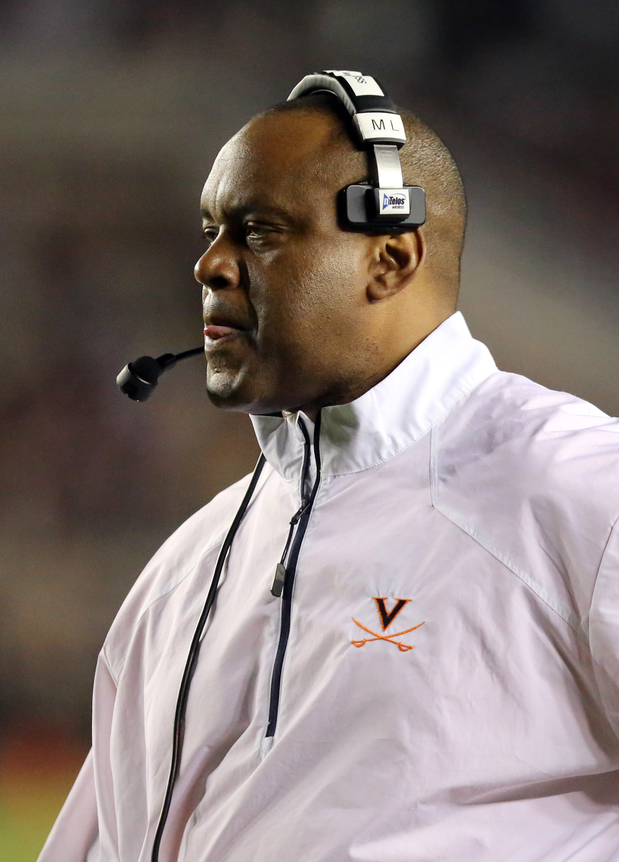 Virginia head coach Mike London watches his team perform against Florida State in the second quarter of an NCAA college football game, Saturday, Nov. 8, 2014, in Tallahassee, Fla. Florida State won the game 34-20. (AP Photo/Steve Cannon)