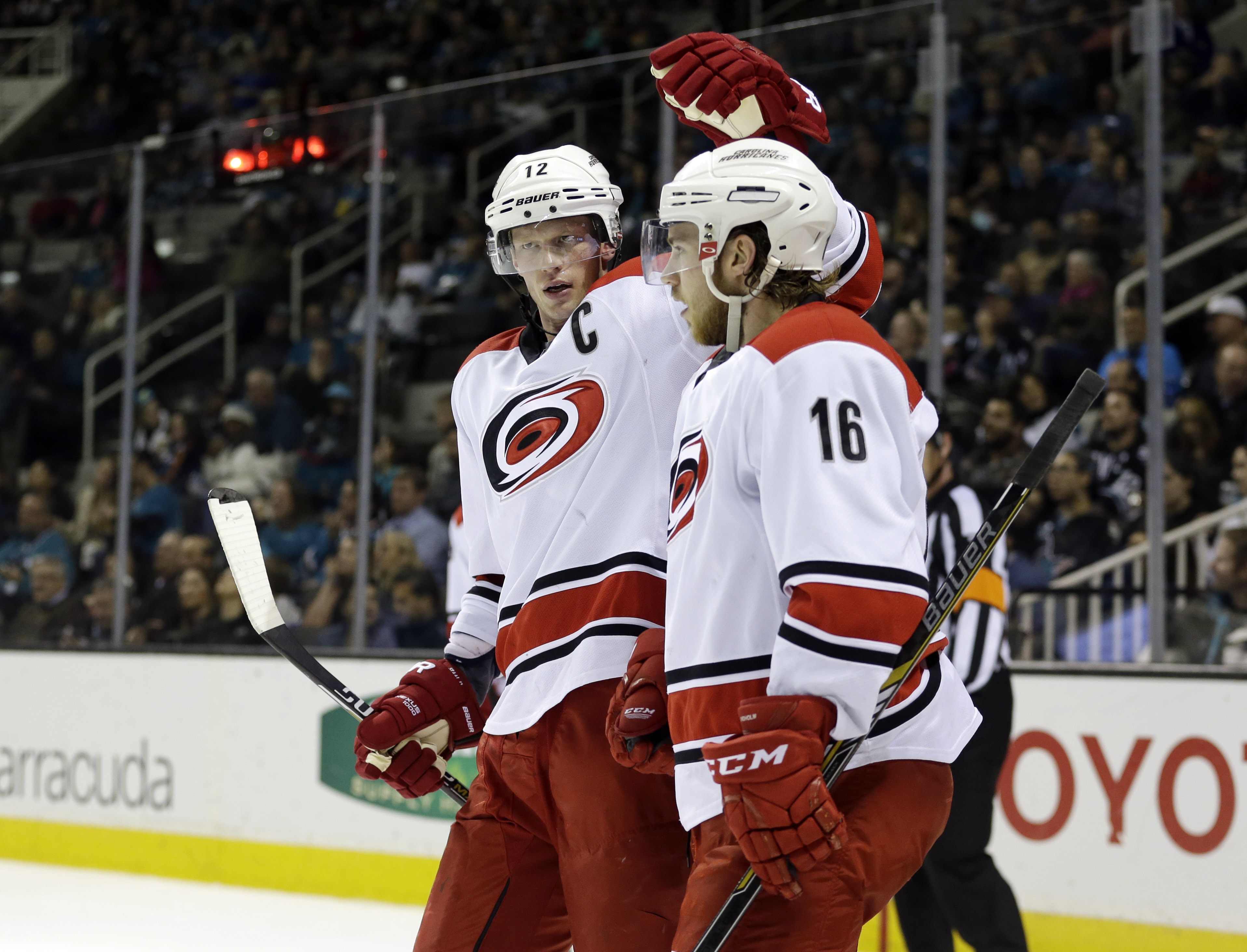 Carolina Hurricanes' Elias Lindholm (16) celebrates his goal with teammate Eric Staal during the second period of an NHL hockey game against the San Jose Sharks on Saturday, Feb. 7, 2015, in San Jose, Calif. (AP Photo/Marcio Jose Sanchez)