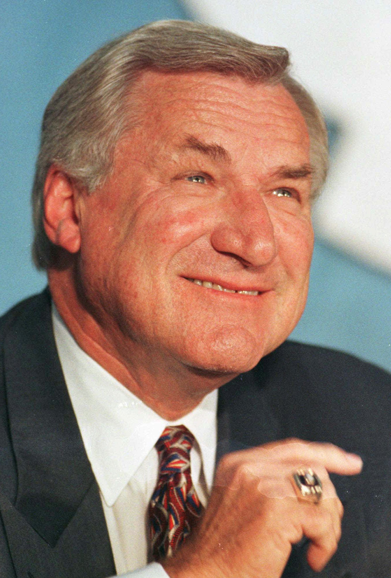 FILE - In an Oct. 9, 1997 file photo, North Carolina basketball coach Dean Smith smiles during a news conference in Chapel Hill, N.C.,where he announced his retirement. Smith, the North Carolina basketball coaching great who won two national championships, died 