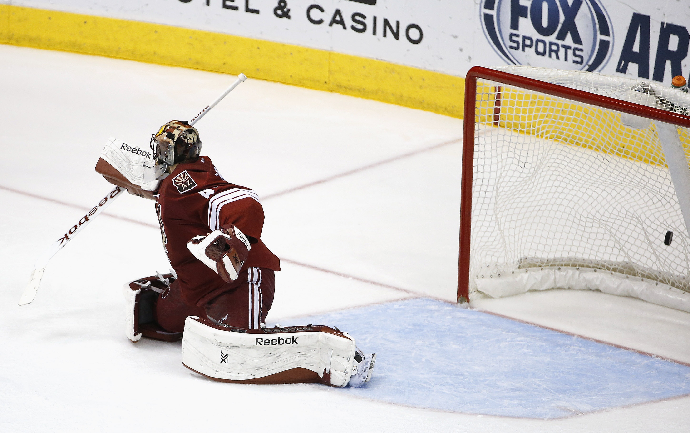 Arizona Coyotes' Mike Smith gives up a goal to Tampa Bay Lightning's Ondrej Palat, of the Czech Republic, during the second period of an NHL hockey game Saturday, Feb. 21, 2015, in Glendale, Ariz. (AP Photo/Ross D. Franklin)