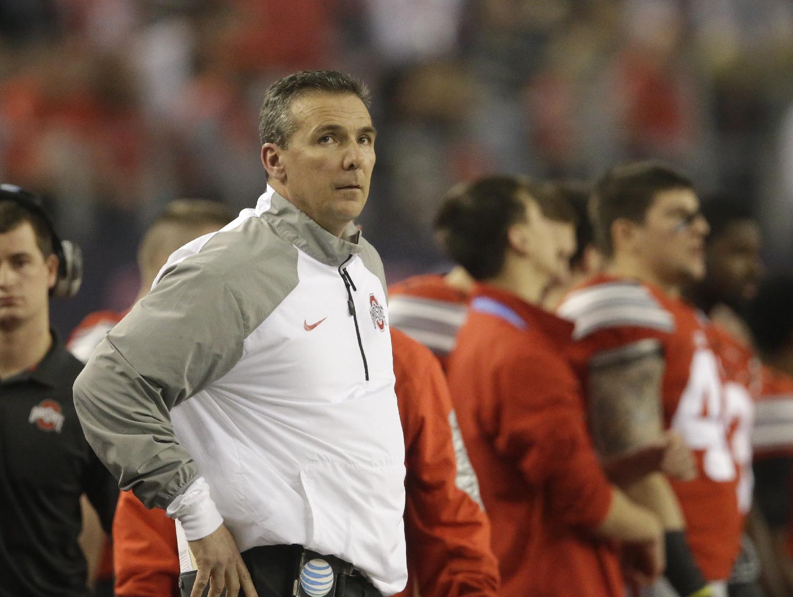 Ohio State head coach Urban Meyer watches during the first half of the NCAA college football playoff championship game against Oregon Monday, Jan. 12, 2015, in Arlington, Texas. (AP Photo/LM Otero)