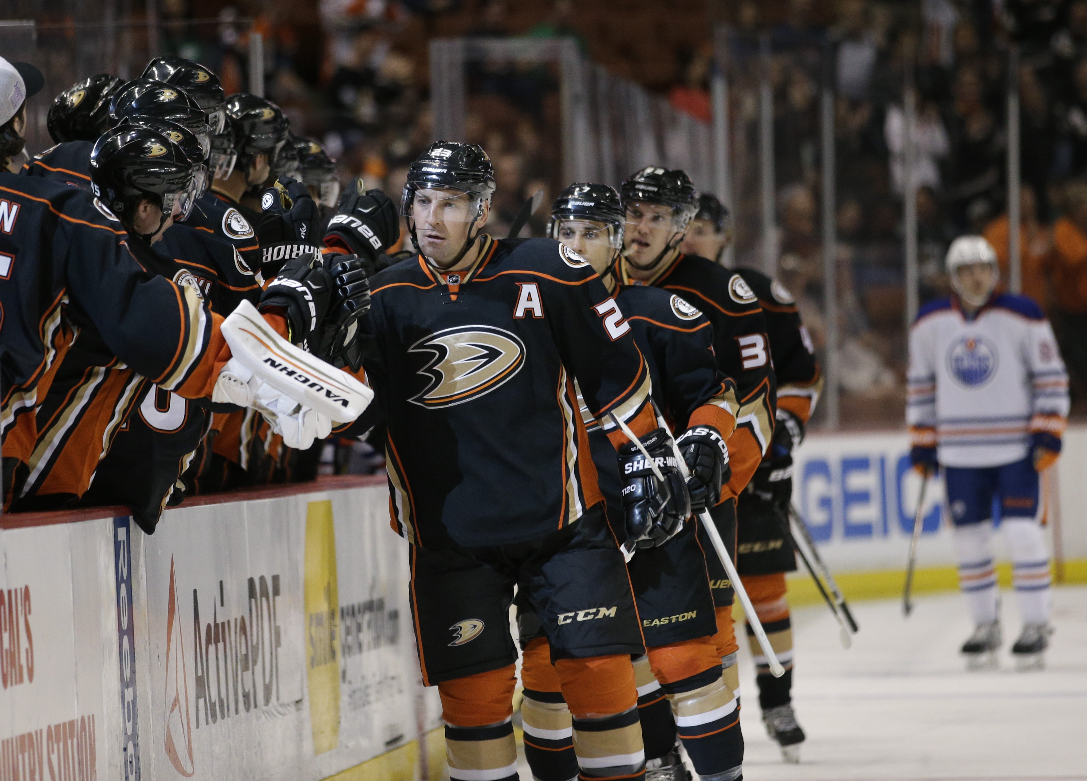 Anaheim Ducks' Francois Beauchemin, center, celebrates his goal with teammates during the first period of an NHL hockey game against the Edmonton Oilers Wednesday, April 1, 2015, in Anaheim, Calif. (AP Photo/Jae C. Hong)