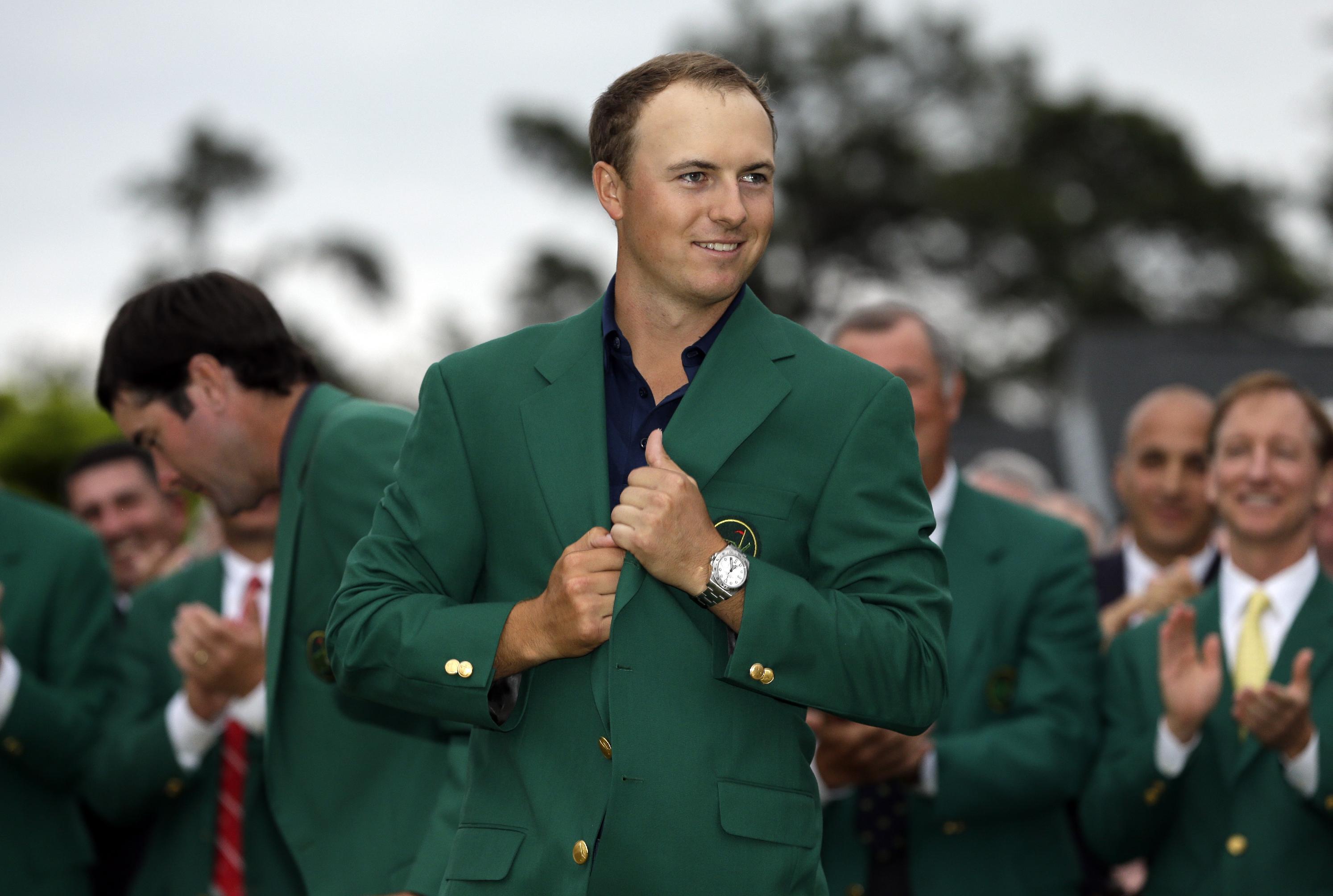 Jordan Spieth wears his green jacket after winning the Masters golf tournament Sunday, April 12, 2015, in Augusta, Ga. (AP Photo/David J. Phillip)