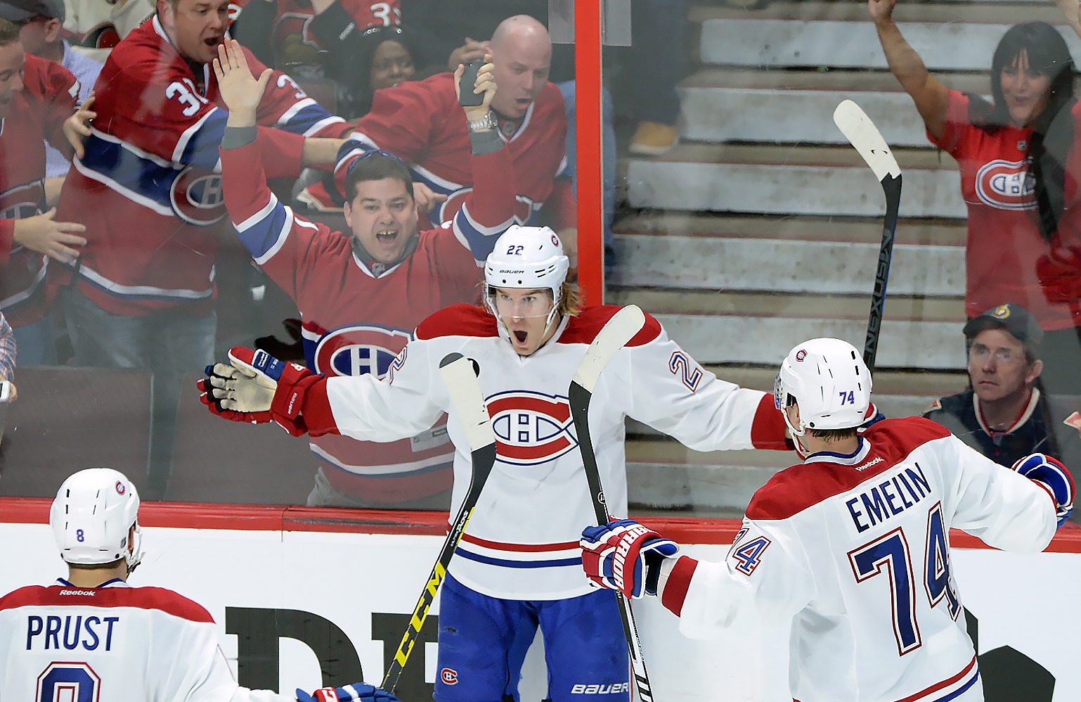 Montreal Canadiens forward Dale Weise (22) celebrates his goal against the Ottawa Senators with teammates Brandon Prust (8) and Alexei Emelin (74) during the third period of game 3 of first round Stanley Cup NHL playoff hockey action in Ottawa, Ontario, Sunday, April 19, 2015. (Sean Kilpatrick/The Canadian Press via AP) MANDATORY CREDIT