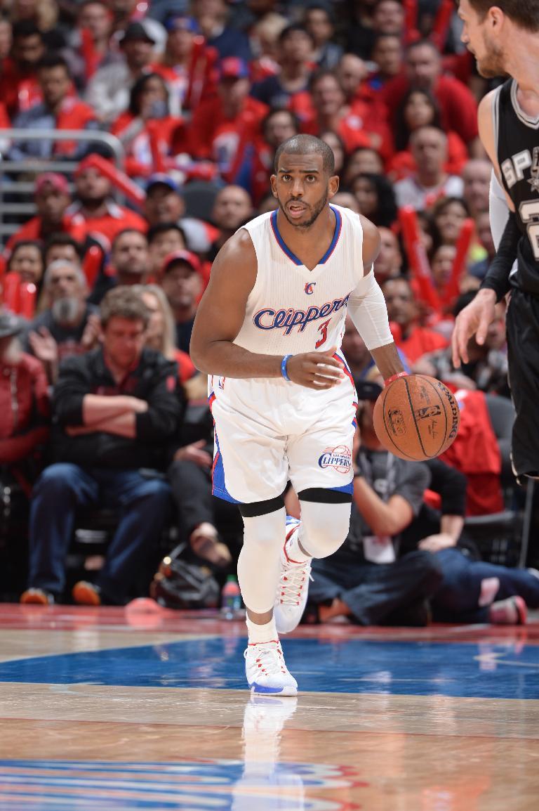 LOS ANGELES, CA - APRIL 19: Chris Paul #3 of the Los Angeles Clippers brings the ball up court against the San Antonio Spurs in Game One of the Western Conference Quarterfinals during the 2015 NBA Playoffs on April 19, 2015 at Staples Center in Los Angeles, California. (Photo by Andrew D. Bernstein/NBAE via Getty Images)