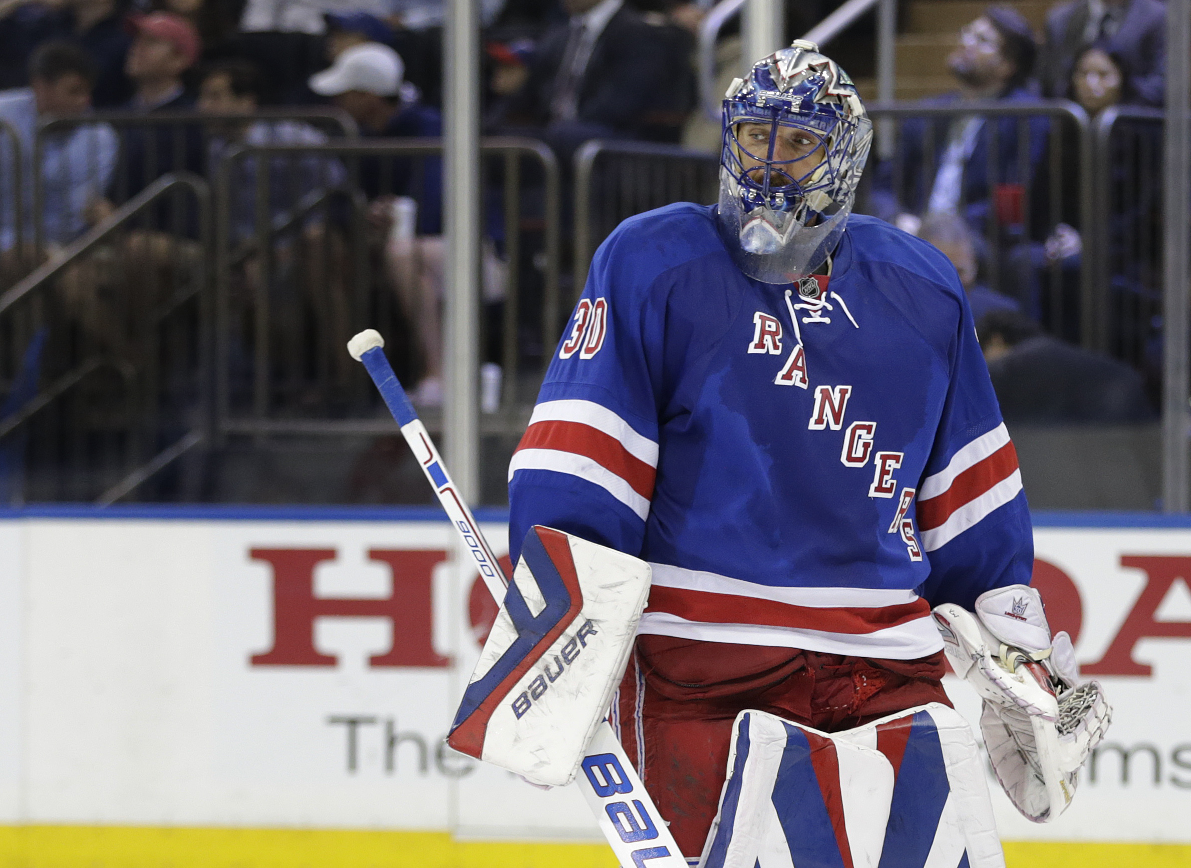 New York Rangers goalie Henrik Lundqvist (30) skates back to the crease during a break in play against the Tampa Bay Lightning during the third period of Game 5 of the Eastern Conference final during the NHL hockey Stanley Cup playoffs, Sunday, May 24, 2015, in New York. The Lightning won 2-0. (AP Photo/Frank Franklin)