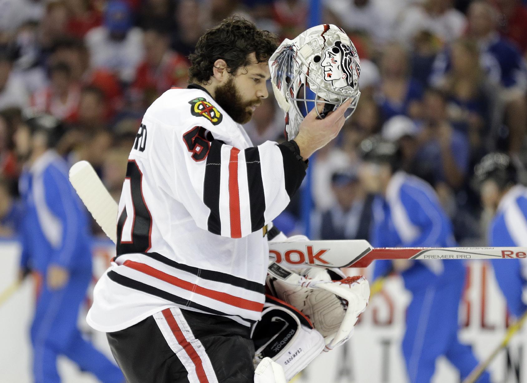 Chicago Blackhawks goalie Corey Crawford walks to the net after giving up a goal to Tampa Bay Lightning defenseman Jason Garrison during the third period in Game 2 of the NHL hockey Stanley Cup Final in Tampa, Fla., Saturday, June 6, 2015. (AP Photo/Chris O'Meara)