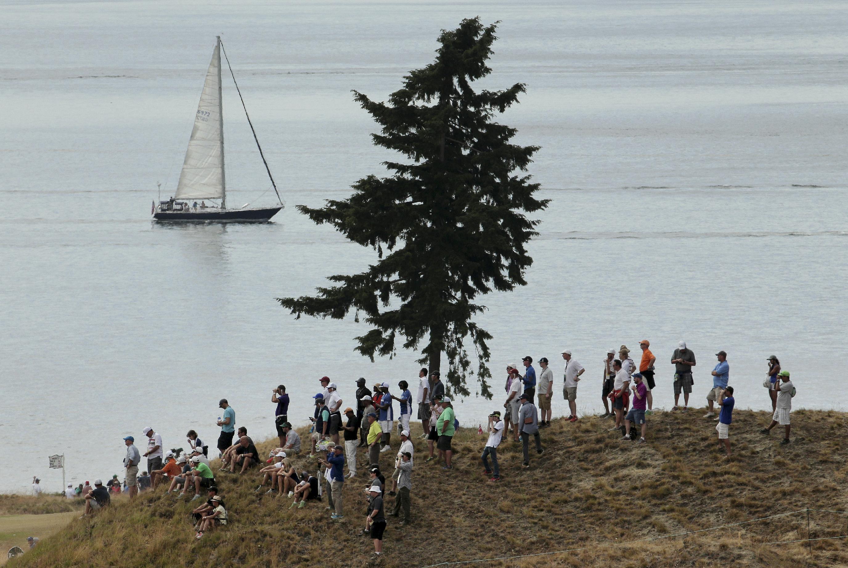 Fans watch during the first round of the U.S. Open golf tournament at Chambers Bay on Thursday, June 18, 2015 in University Place, Wash. (AP Photo/Charlie Riedel)