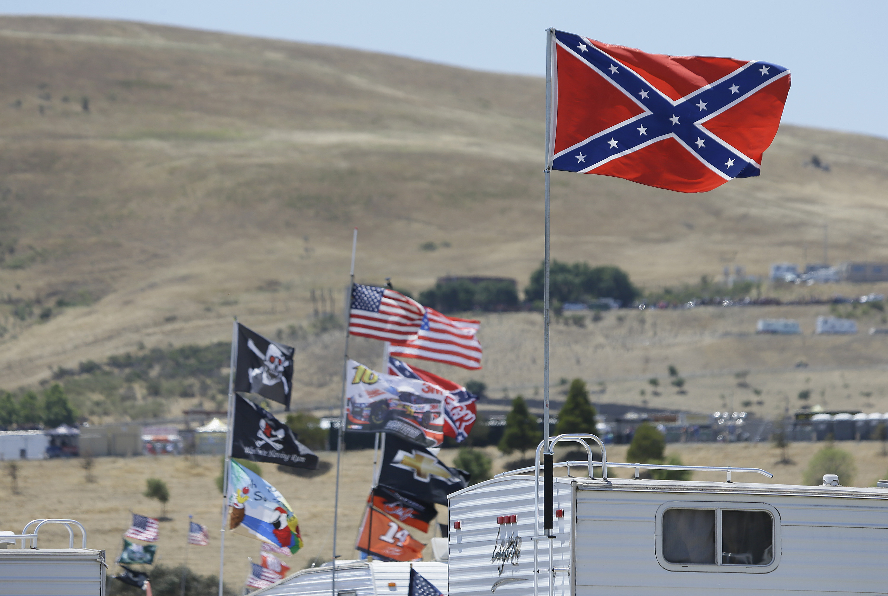 A Confederate-themed flag flies atop an RV at the NASCAR race in June's Sonoma. (AP)