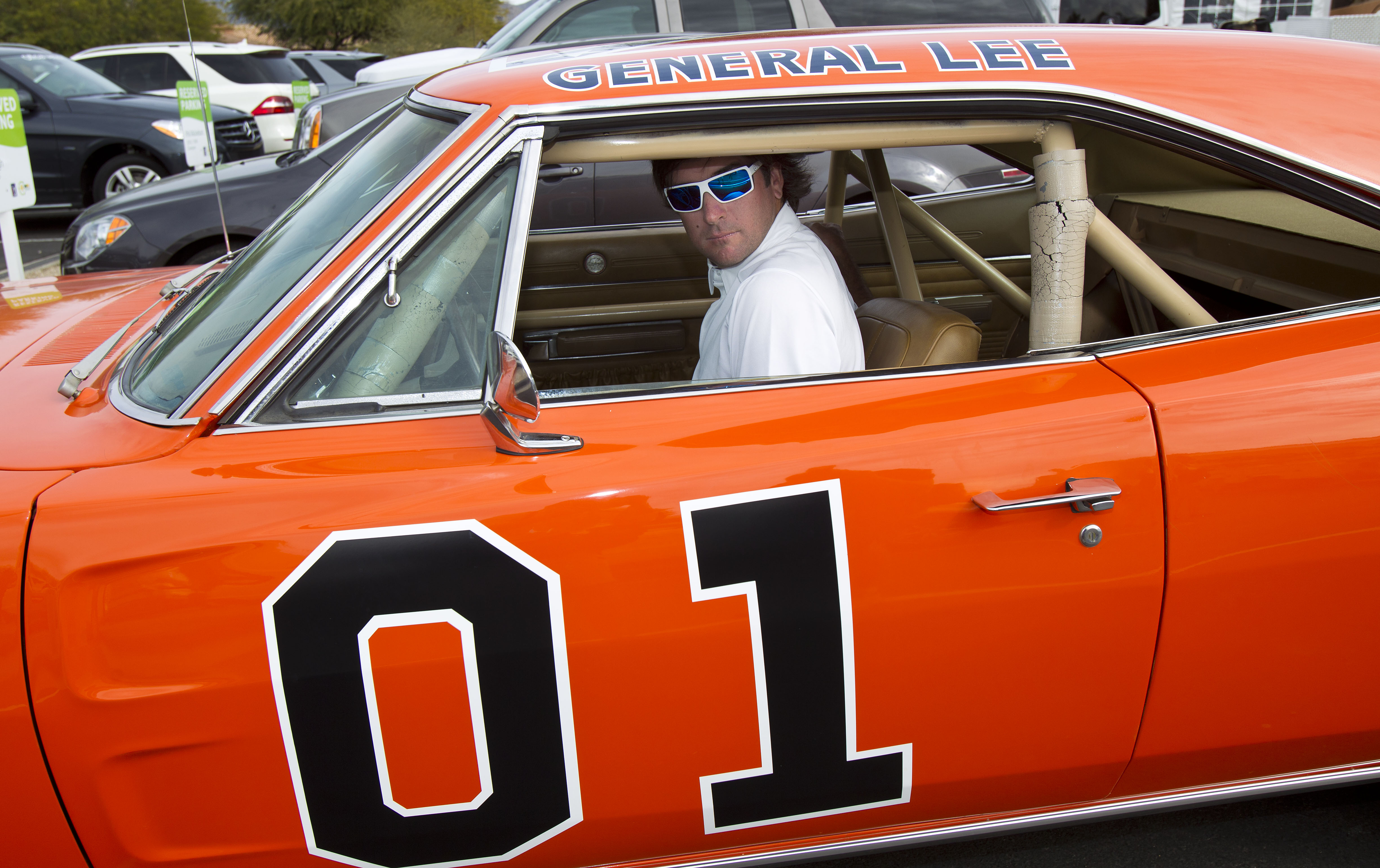 Bubba Watson drives off in the General Lee after playing in the pro-am at the Phoenix Open. (AP)