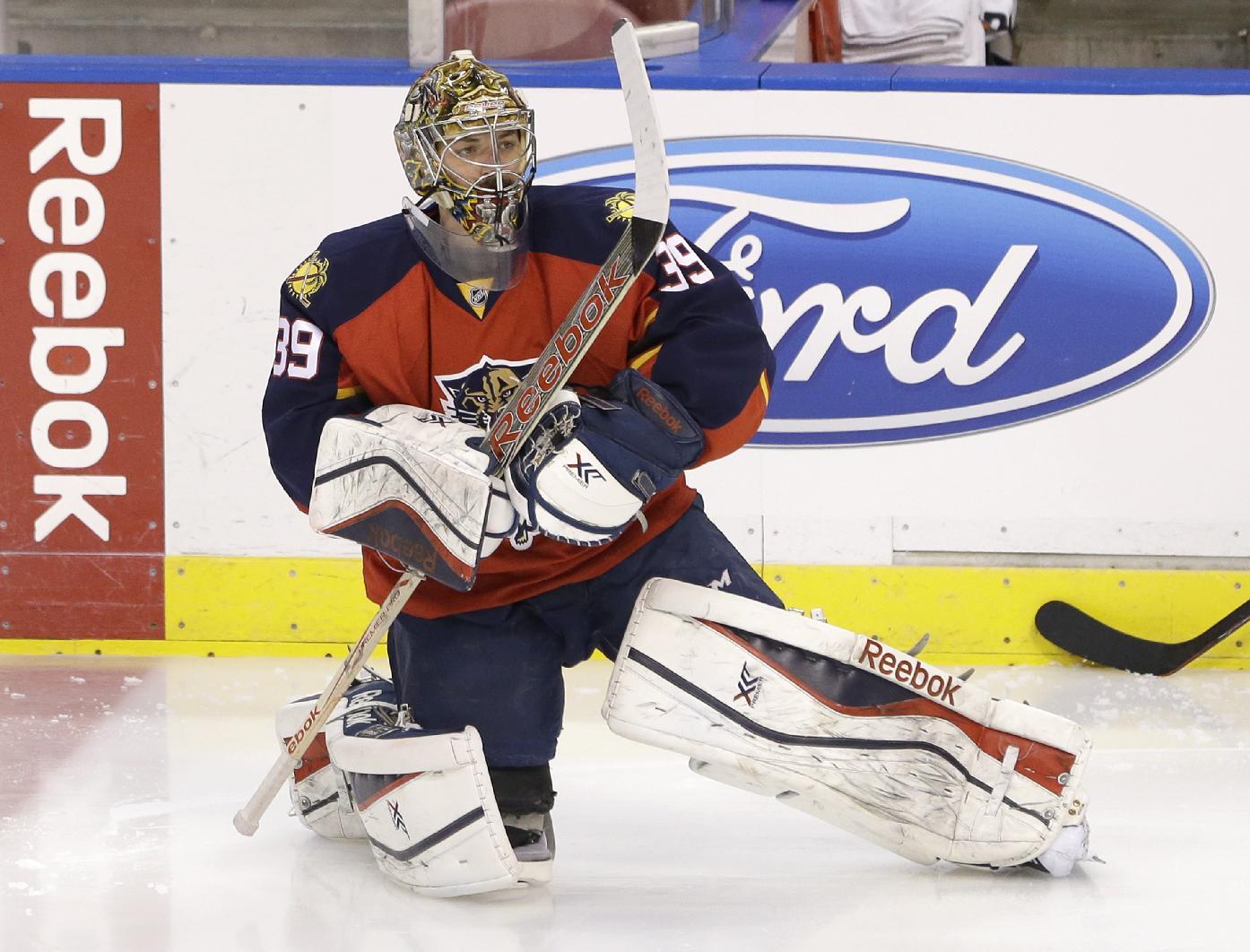 Florida Panthers goalie Dan Ellis warms up before the start of an NHL hockey game against the Tampa Bay Lightning, Saturday, April 4, 2015 in Sunrise, Fla. (AP Photo/Wilfredo Lee)