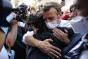 In devastated Beirut, French leader offers comfort and a hug