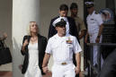 The Latest: Navy SEAL sentenced for posing with dead captive