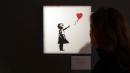 Banksy artwork shreds itself right after selling at auction for $1.4 million