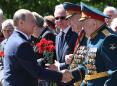 Putin uses World War II parade to boost support before vote
