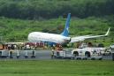Chinese plane slides off Manila runway causing flight delays