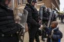 Justice Department asks for 90 days to review agreement with Baltimore
