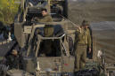 The Latest: Israel military beefs up presence on Gaza border