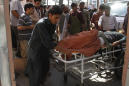 Bus hit by roadside bomb in Afghanistan, 32 killed