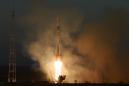 Soyuz arrives at ISS on first manned mission since October failure