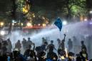 Thai police use water cannon to stop pro-democracy march to palace