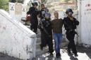 Heavy police raids leave east Jerusalem neighborhood on edge