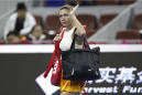 Halep retires from China Open 1st round with back injury