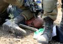 Image of Palestinian under Israeli soldier's knee sparks outrage