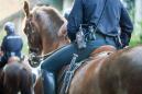 Texas Police Department Under Fire After Viral Photo Shows Officers on Horseback Leading Handcuffed Man By Rope